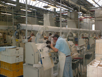 Workers at Waterford Crystal factory grinding the crystal. Photo by Brian Walsh on Flickr.