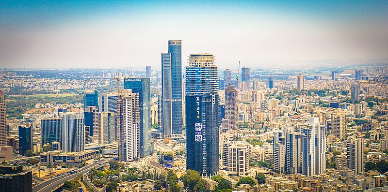 Photos taken from the top of Azrieli Center Circular Tower, currently the tallest building in Israel, at 53 stories. Azrieli Sarona, when finished, will be the tallest building at 73 stories. An even taller building, Rockefeller Center, has been commissioned and will be 80 stories tall...In the views, you can see Azrieli Sarona under construction, Shalom Tower, from 1965-1999 the tallest building in Israel at 36 stories, as well as Port of Tel Aviv with Sde Dov Airport. The Electra (Elco) Tower, also pictured, houses Google Israel and is currently the 3rd tallest building...See: https://en.wikipedia.org/wiki/List_of_tallest_buildings_in_Tel_Aviv; https://officesnapshots.com/2013/01/31/google-tel-aviv-office-design/