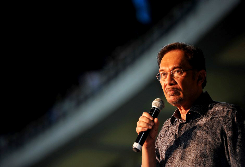 Malaysian opposition leader Anwar Ibrahim speaks during a rally dressed in mourning black gathered to denounce elections which they claim were stolen through fraud by the coalition that has ruled for 56 years. in Penang May 11 2013. Pix Firdaus Latif